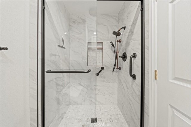 19439 Oak Crossing Rd, Newhall, CA 91321 - bathroom featuring a marble finish shower