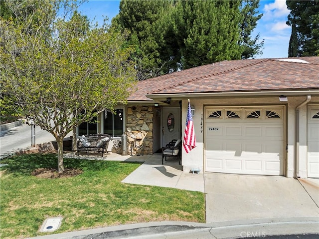 19439 Oak Crossing Rd, Newhall, CA 91321 - ranch-style home with a garage, a front yard, concrete driveway, and stone siding