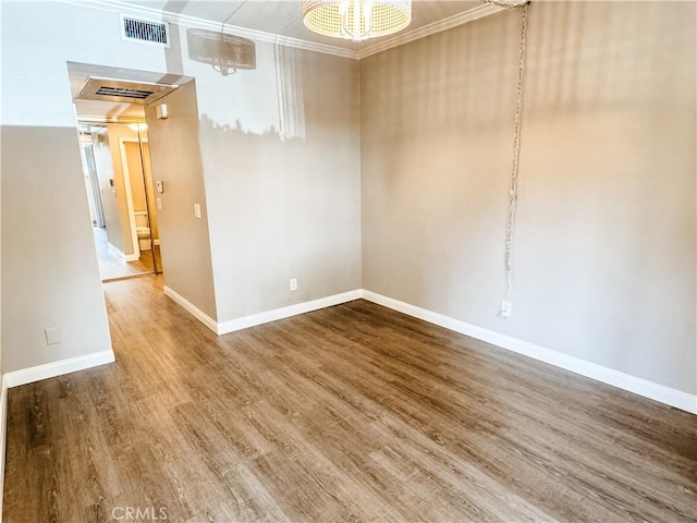 2474 Pleasant Way Unit E, Thousand Oaks, CA 91362 - unfurnished room featuring wood finished floors, a chandelier, and crown molding