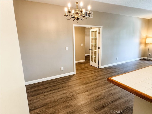 2474 Pleasant Way Unit E, Thousand Oaks, CA 91362 - spare room with a chandelier, dark wood-style flooring, and french doors