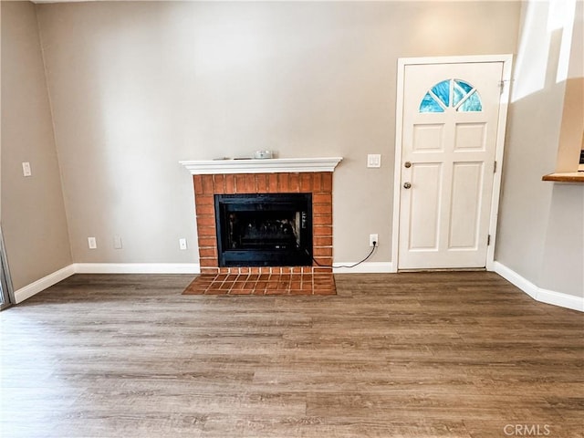 2474 Pleasant Way Unit E, Thousand Oaks, CA 91362 - unfurnished living room with wood finished floors and a fireplace