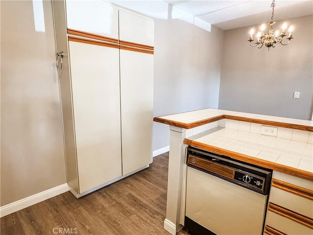 2474 Pleasant Way Unit E, Thousand Oaks, CA 91362 - kitchen featuring tile countertops, wood finished floors, white cabinetry, and a chandelier