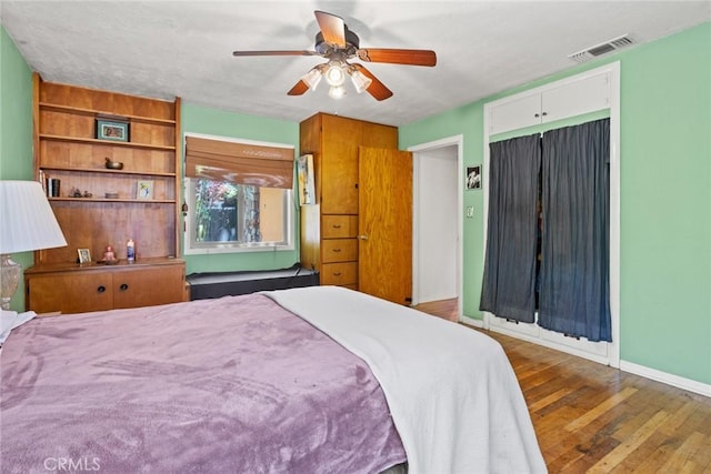 297 Connors Ave, Chico, CA 95926 - bedroom with hardwood / wood-style floors, baseboards, a ceiling fan, and a closet