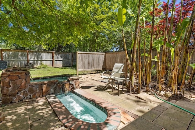 297 Connors Ave, Chico, CA 95926 - fenced backyard featuring a patio and a pool with connected hot tub