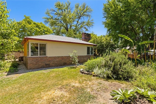297 Connors Ave, Chico, CA 95926 - view of side of home with brick siding, a chimney, and stucco siding