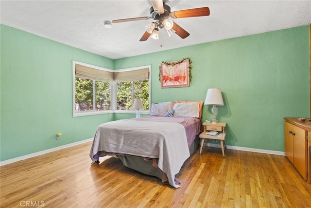 297 Connors Ave, Chico, CA 95926 - bedroom featuring baseboards, light wood finished floors, and a ceiling fan