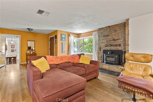 297 Connors Ave, Chico, CA 95926 - living room featuring a wood stove and light wood-type flooring