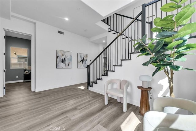 689 Castlehill Dr, Walnut, CA 91789 - staircase with wood finished floors, baseboards, and recessed lighting