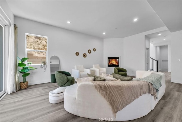 689 Castlehill Dr, Walnut, CA 91789 - living room featuring wood finished floors, recessed lighting, a glass covered fireplace, and baseboards