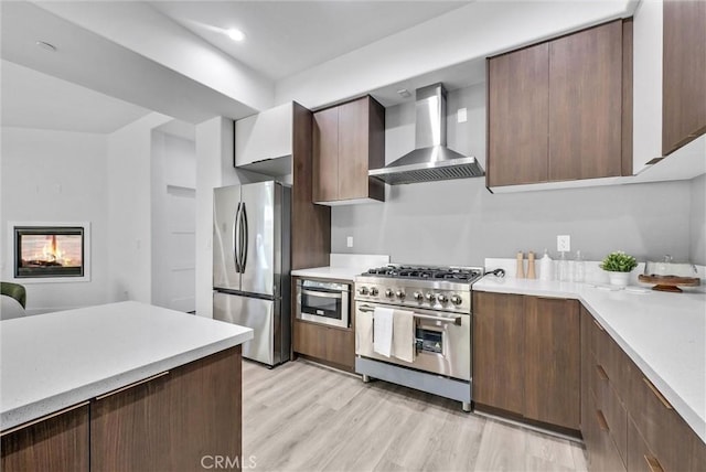 689 Castlehill Dr, Walnut, CA 91789 - kitchen with wall chimney exhaust hood, appliances with stainless steel finishes, light countertops, and recessed lighting