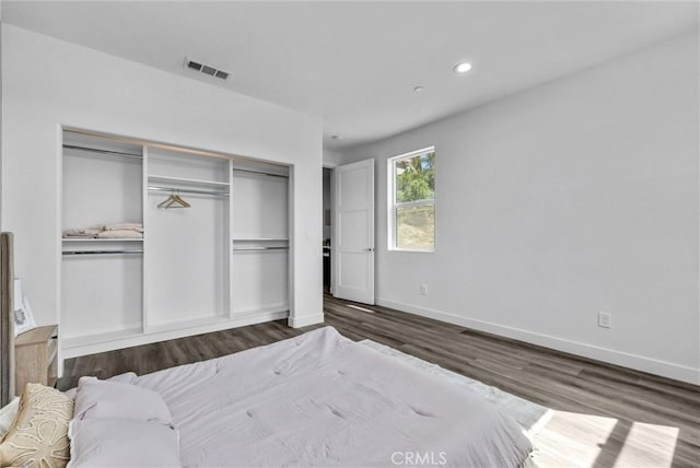 689 Castlehill Dr, Walnut, CA 91789 - bedroom with dark wood-style flooring, a closet, baseboards, and recessed lighting