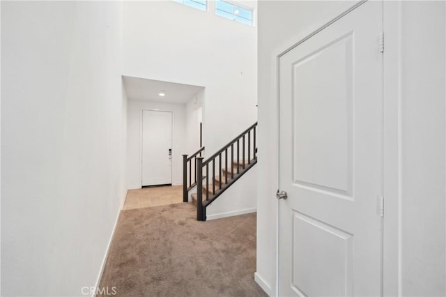 36927 Arezzo Ct, Beaumont, CA 92223 - hall with carpet flooring, baseboards, and a towering ceiling