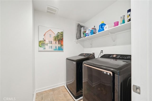 36927 Arezzo Ct, Beaumont, CA 92223 - laundry area with washing machine and clothes dryer and baseboards