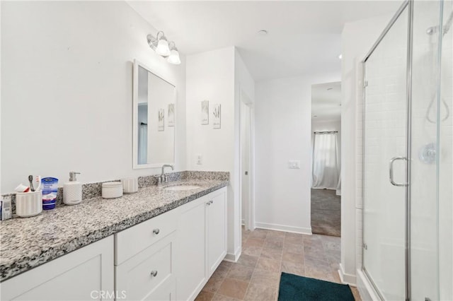 36927 Arezzo Ct, Beaumont, CA 92223 - bathroom featuring a stall shower, baseboards, and vanity