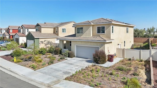 36927 Arezzo Ct, Beaumont, CA 92223 - traditional-style house featuring fence, stucco siding, an attached garage, concrete driveway, and a residential view