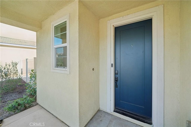 36927 Arezzo Ct, Beaumont, CA 92223 - doorway to property featuring stucco siding