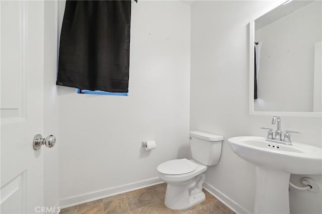 36927 Arezzo Ct, Beaumont, CA 92223 - half bathroom with baseboards, toilet, and a sink