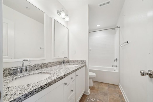 36927 Arezzo Ct, Beaumont, CA 92223 - full bath with toilet, stone finish floors, baseboards, double vanity, and recessed lighting