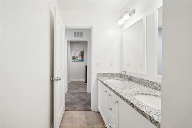 36927 Arezzo Ct, Beaumont, CA 92223 - bathroom featuring double vanity and baseboards