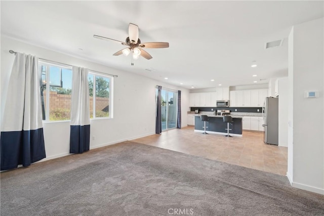 36927 Arezzo Ct, Beaumont, CA 92223 - unfurnished living room with ceiling fan, light carpet, baseboards, and recessed lighting