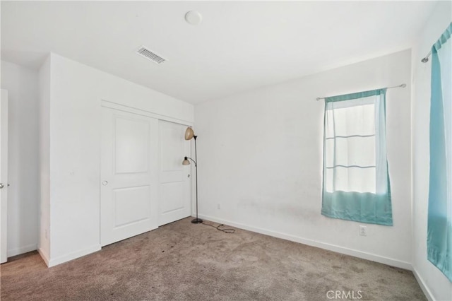 36927 Arezzo Ct, Beaumont, CA 92223 - unfurnished bedroom featuring carpet floors, baseboards, and a closet