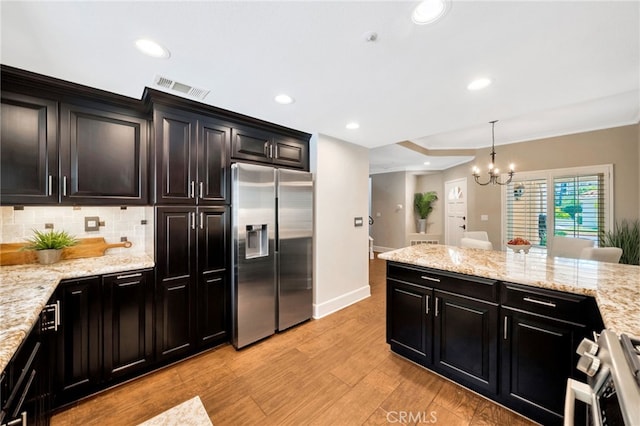 417 Via Presa, San Clemente, CA 92672 - kitchen featuring appliances with stainless steel finishes, light wood-type flooring, tasteful backsplash, ornamental molding, and baseboards