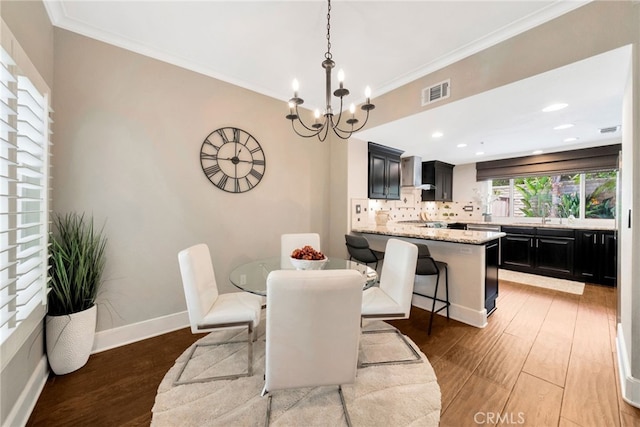 417 Via Presa, San Clemente, CA 92672 - dining room featuring wood finished floors, a chandelier, crown molding, and baseboards