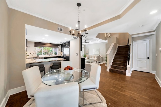 417 Via Presa, San Clemente, CA 92672 - dining room with ornamental molding, dark wood-type flooring, a chandelier, stairs, and baseboards