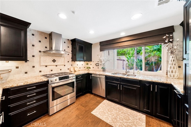 417 Via Presa, San Clemente, CA 92672 - kitchen with appliances with stainless steel finishes, wall chimney range hood, a sink, backsplash, and recessed lighting