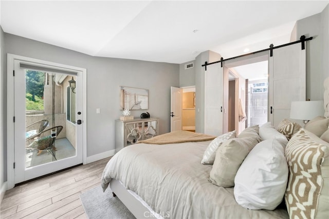 417 Via Presa, San Clemente, CA 92672 - bedroom with a barn door, access to outside, light wood-style flooring, and baseboards