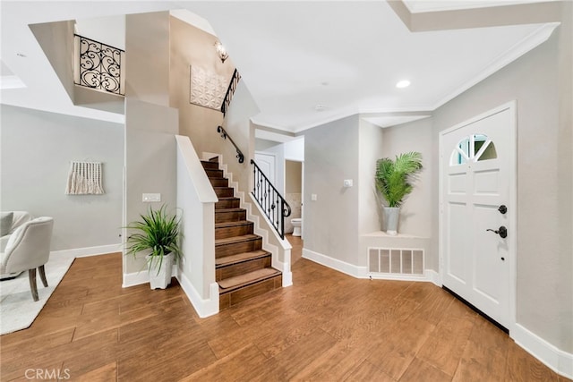 417 Via Presa, San Clemente, CA 92672 - entrance foyer with crown molding, stairs, baseboards, recessed lighting, and wood finished floors