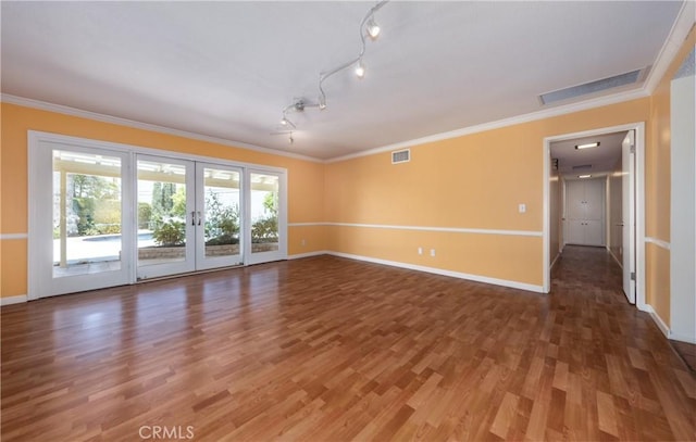 645 Alta Loma Dr, Redlands, CA 92373 - unfurnished room featuring wood finished floors, french doors, baseboards, crown molding, and track lighting