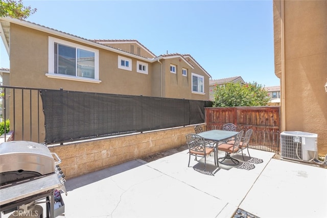 27435 Larabee Ct Unit 2, Murrieta, CA 92562 - view of patio with central AC unit, a fenced backyard, a grill, and outdoor dining area