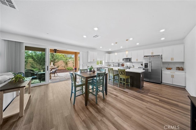 2569 Pasture Gln, Escondido, CA 92029 - dining room featuring wood finished floors and recessed lighting