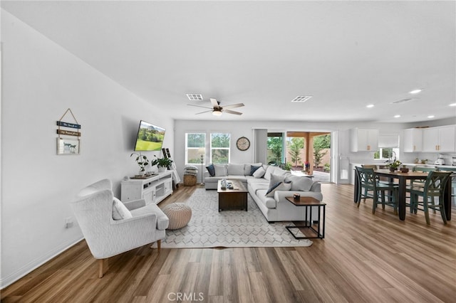 2569 Pasture Gln, Escondido, CA 92029 - living area with wood finished floors, ceiling fan, recessed lighting, and baseboards