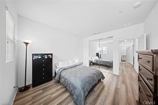 2569 Pasture Gln, Escondido, CA 92029 - bedroom featuring light wood-style floors and a closet