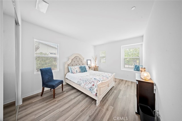 2569 Pasture Gln, Escondido, CA 92029 - bedroom featuring light wood-style flooring and baseboards