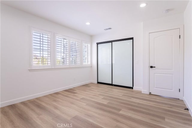 17195 Summit Hills Dr, Canyon Country, CA 91387 - unfurnished bedroom featuring light wood finished floors, recessed lighting, baseboards, and a closet