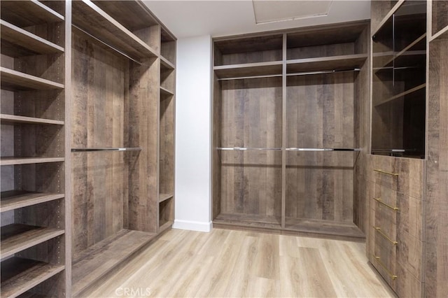17195 Summit Hills Dr, Canyon Country, CA 91387 - spacious closet with wood finished floors and attic access