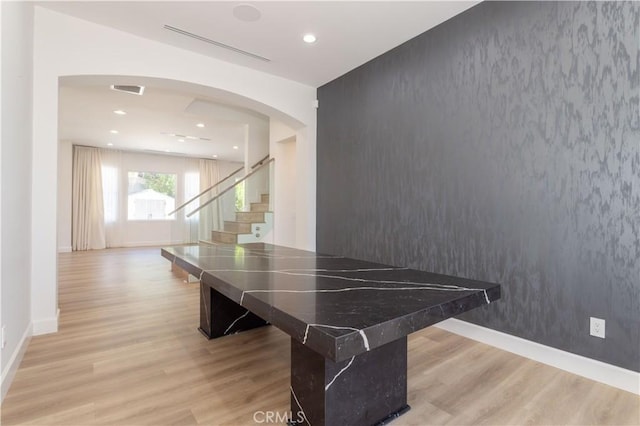 17195 Summit Hills Dr, Canyon Country, CA 91387 - game room with an accent wall, light wood-type flooring, baseboards, recessed lighting, and arched walkways