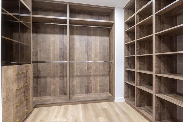 17195 Summit Hills Dr, Canyon Country, CA 91387 - spacious closet with wood finished floors