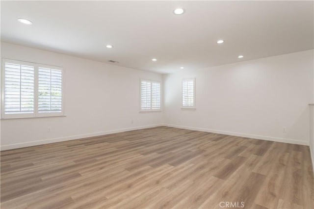 17195 Summit Hills Dr, Canyon Country, CA 91387 - empty room with recessed lighting, light wood-style flooring, and baseboards