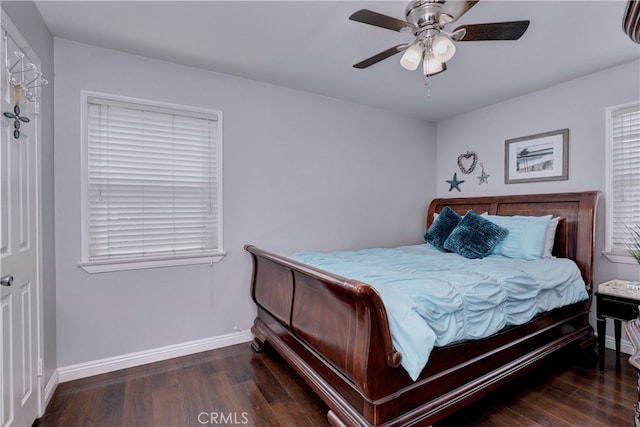 bedroom featuring wood finished floors, baseboards, and a ceiling fan