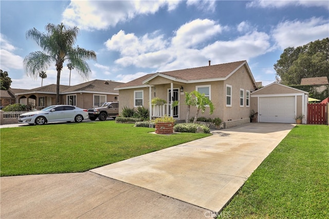 ranch-style house featuring stucco siding, driveway, a front yard, and a detached garage