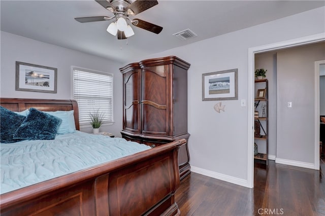 bedroom with dark wood-style floors, baseboards, and ceiling fan