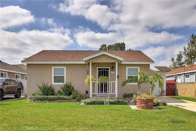 view of front of home with stucco siding and concrete driveway