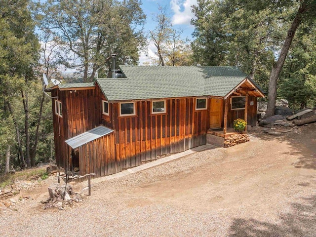 21932 Crestline Rd, Palomar Mountain, CA 92060 - chalet / cabin with a shingled roof and board and batten siding