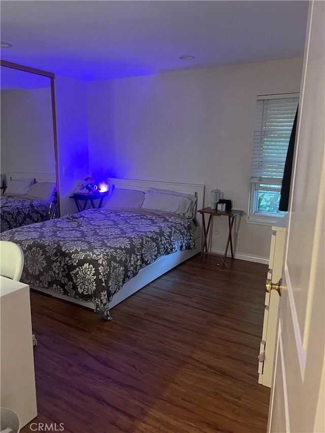 7111 Farralone Ave Unit 104, Canoga Park, CA 91303 - bedroom featuring wood finished floors and baseboards