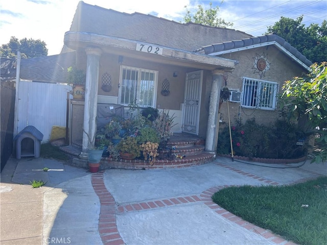 702 N Burris Ave, Compton, CA 90221 - view of front of property with fence and stucco siding