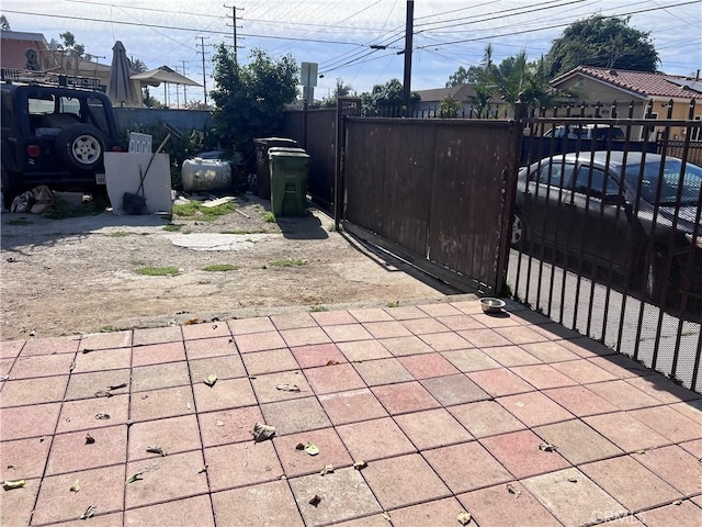 702 N Burris Ave, Compton, CA 90221 - view of patio featuring fence and a gate